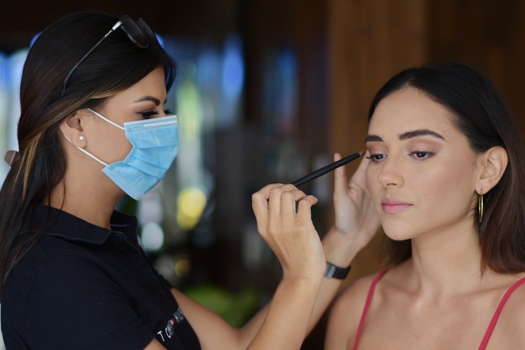 A close-up of a woman's face with subtle contouring and highlighting, showcasing natural beauty and soft makeup application.